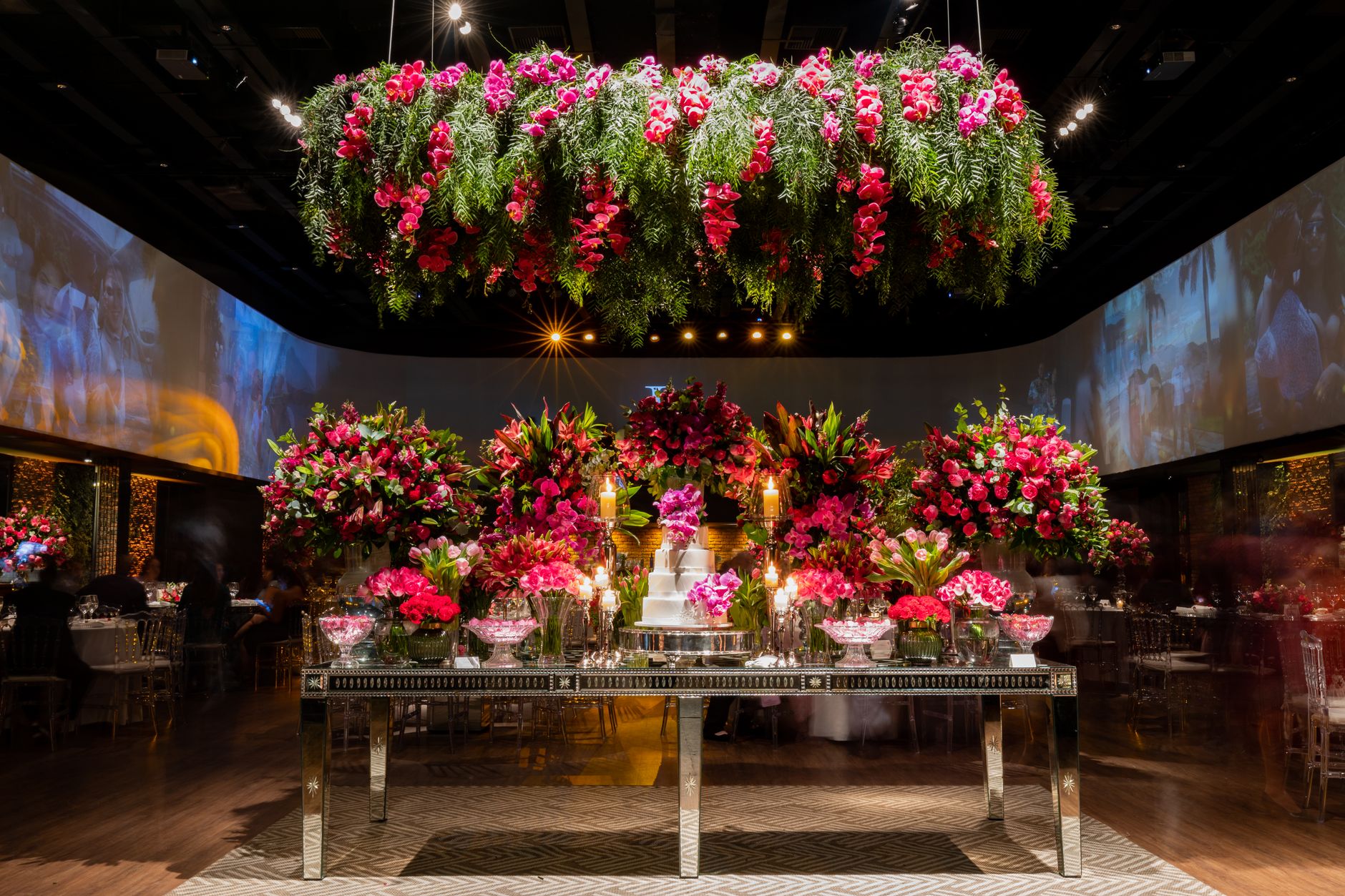 Stunning flower arrangements and cake table set in an elegant indoor venue. — Decorating an infant Nursery on a tight budget